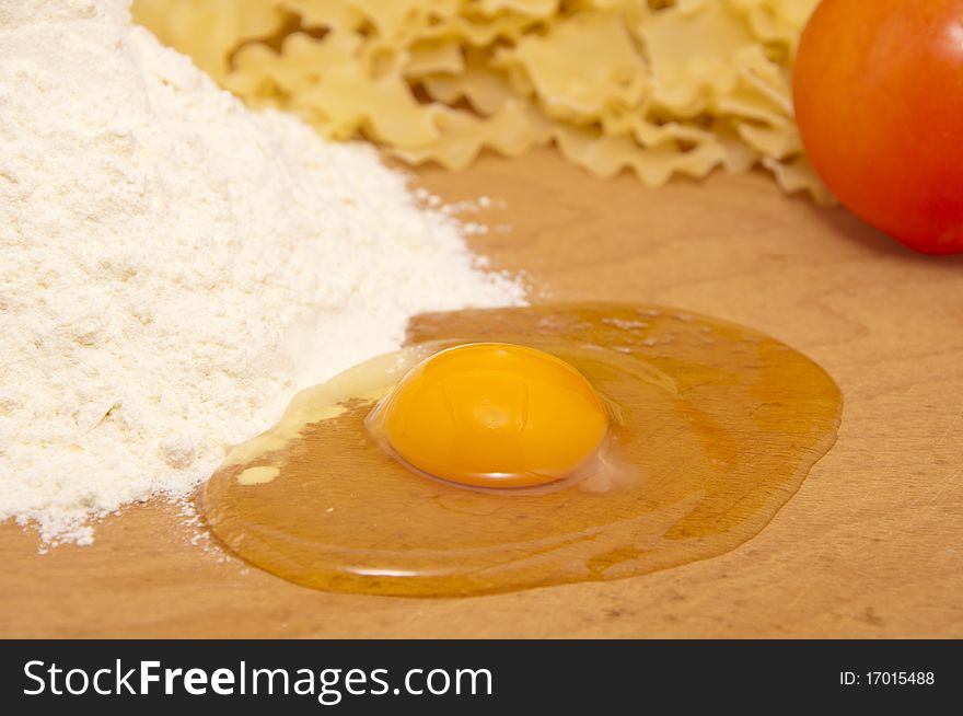 Nice fresh pasta ingredients on a board to knead dough