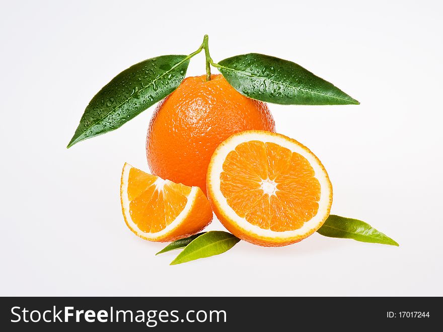 Freash oranges with leaves on white background