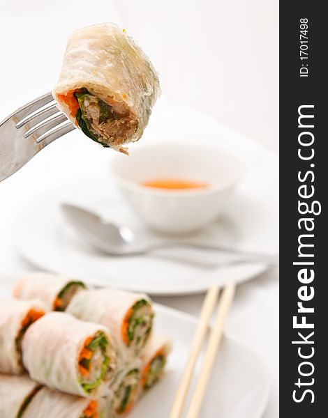 Famous Vietnamese food, rolled vegetables dip in sauce. Famous Vietnamese food, rolled vegetables dip in sauce