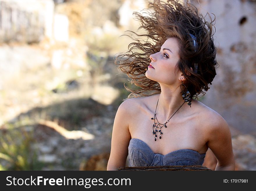 View of a beautiful woman, swinging the hair on a wild way. View of a beautiful woman, swinging the hair on a wild way.