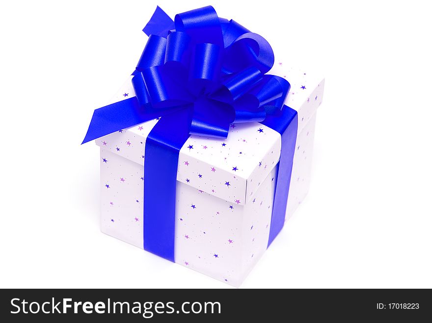 White gift box with blue ribbon isolated on white