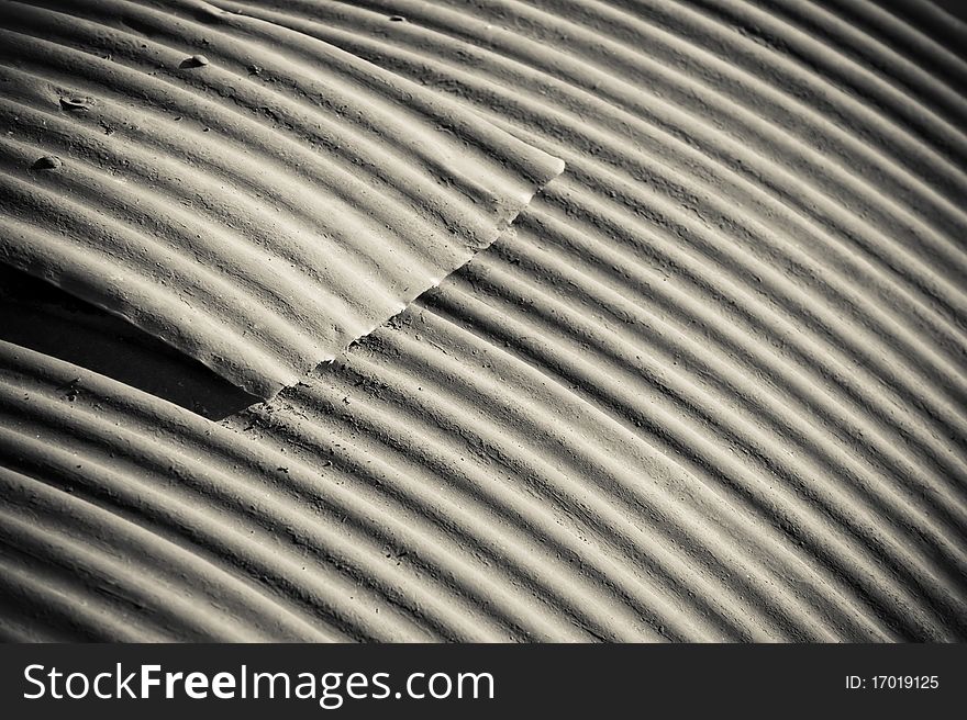 Rough surfaced background of rusting corrugated metal roofing. Rough surfaced background of rusting corrugated metal roofing