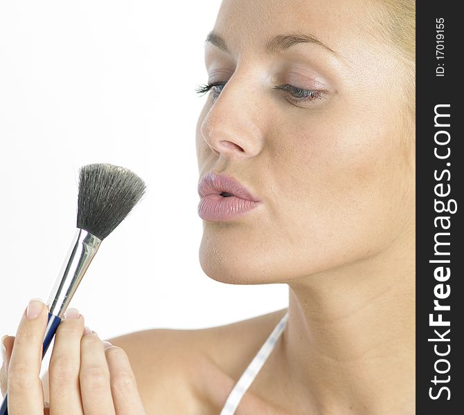 Portrait of young woman with make up brush. Portrait of young woman with make up brush