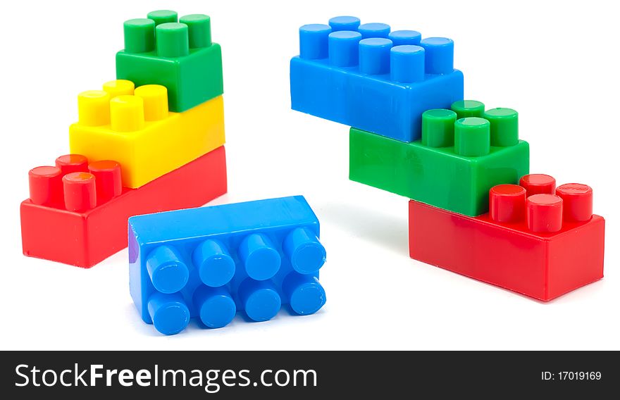 Studio shot of stack of colorful building blocks on white background. Studio shot of stack of colorful building blocks on white background