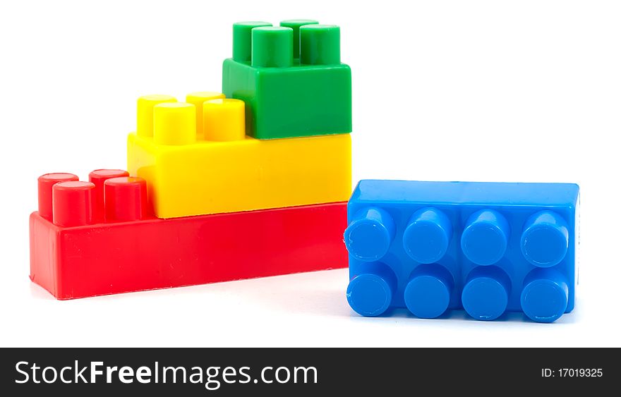 Studio shot of stack of colorful building blocks on white background. Studio shot of stack of colorful building blocks on white background
