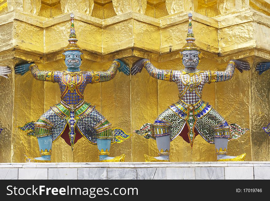 Thai giant design elements of royal gold religious stupa in grand palace, Bangkok Thailand. Thai giant design elements of royal gold religious stupa in grand palace, Bangkok Thailand