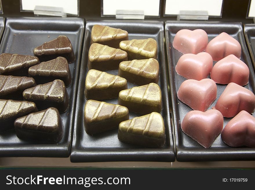 Triangle and heart shape assorted chocolate on trays