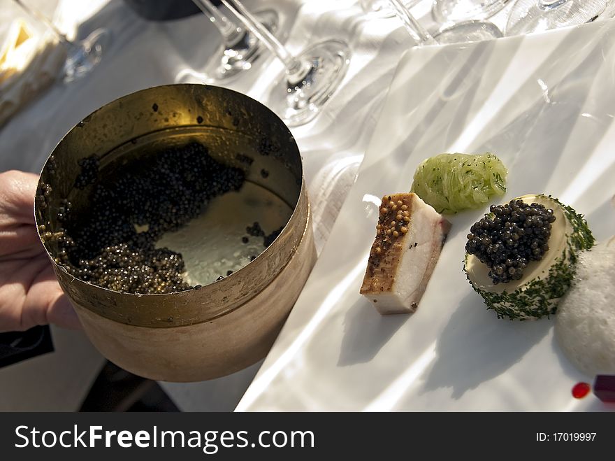 Different sorts of caviar on a white plate. Different sorts of caviar on a white plate