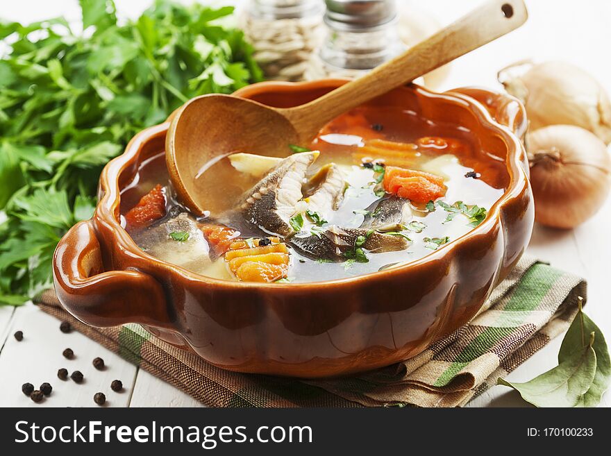 Fish soup with vegetables on the table. Fish soup with vegetables on the table