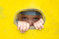 Little Girl Look Out Of The Hole In Painted Wall. Stock Images Little Girl Look Out Of The Hole In Painted Wall. Stock Images