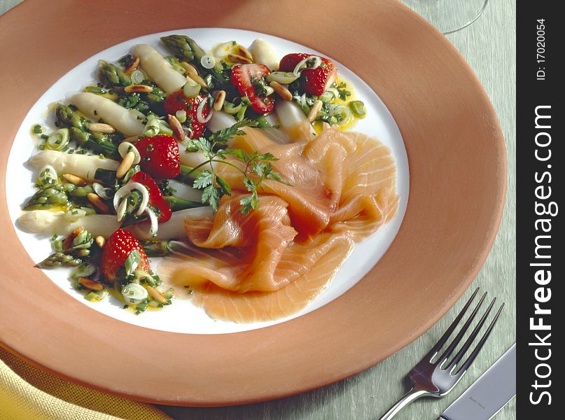 Salmon served with asparagus salad. Salmon served with asparagus salad