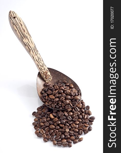 Isolated wooden Spoon with on coffee beans it. Isolated wooden Spoon with on coffee beans it.