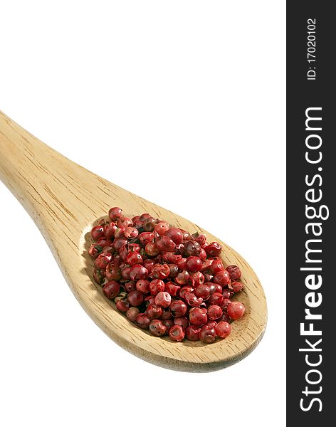 Isolated wooden Spoon with on red pepper it. Isolated wooden Spoon with on red pepper it.