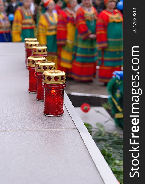 Lamps with candles at a monument