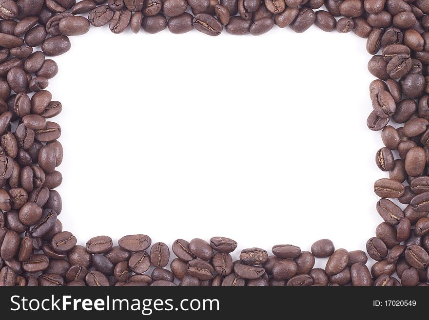 Frame of dark roasted coffee beans isolated on a white background