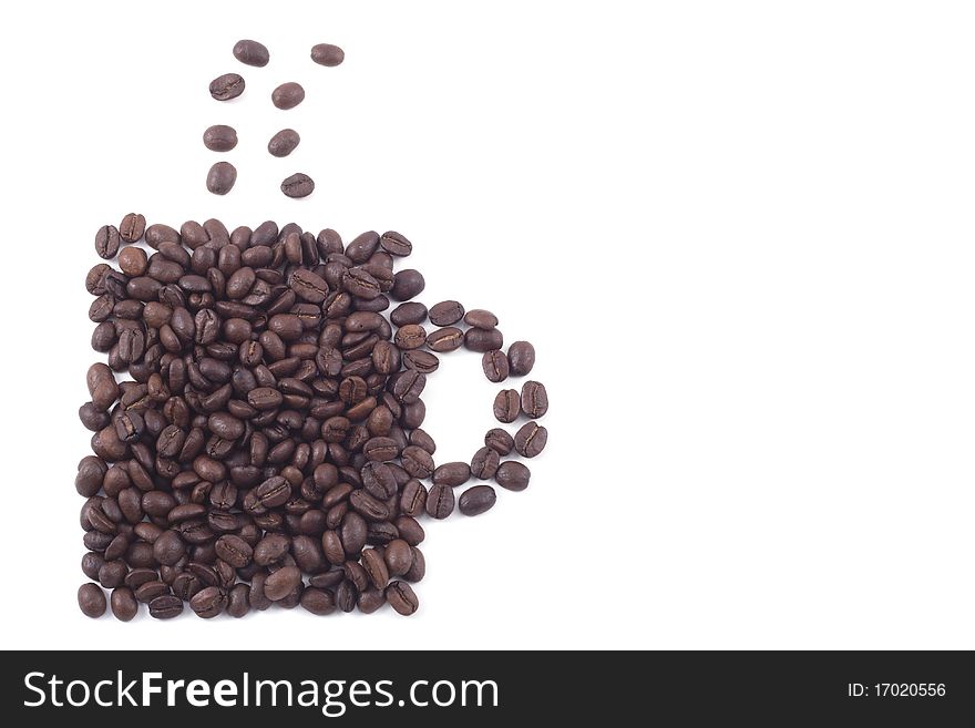 Cup of dark roasted coffee beans isolated on white