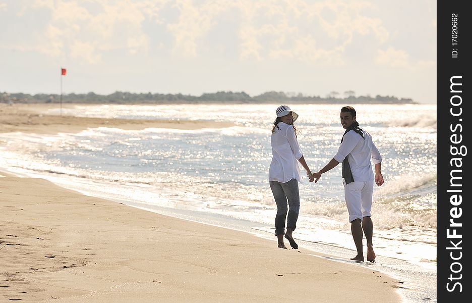 Happy Young Couple Have Fun At Beautiful Beach