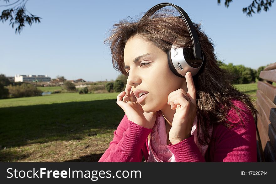 Pretty young girl listening music