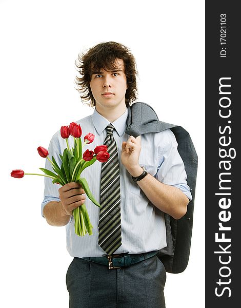 An image of a young man with red tulips. An image of a young man with red tulips