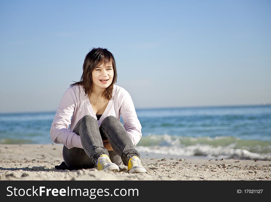 Portrait of brunette girl at the beach.