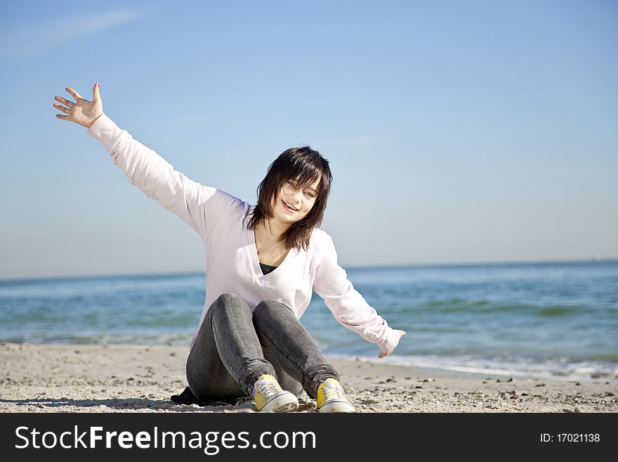 Portrait Of Brunette Girl At The Beach.