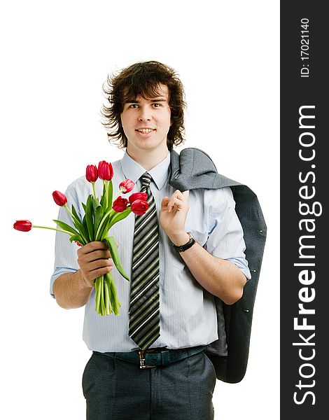 An image of a young cheerful man with red tulips. An image of a young cheerful man with red tulips