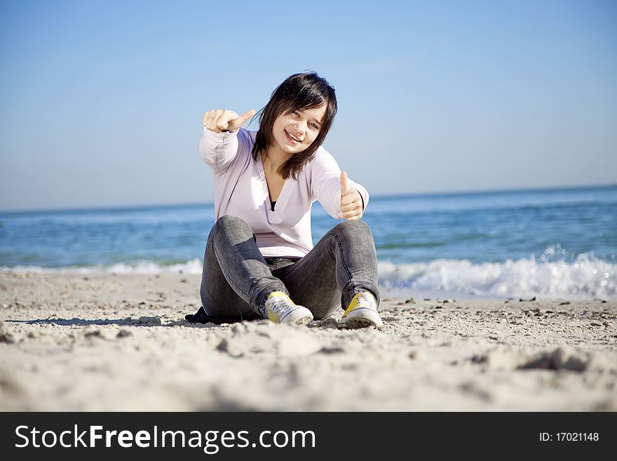 Portrait Of Brunette Girl At The Beach.