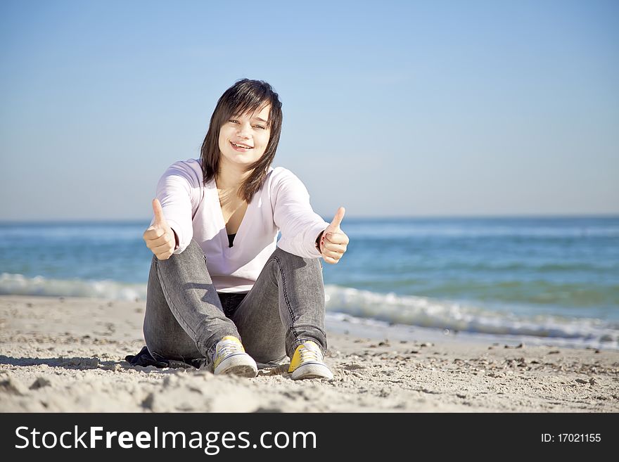 Portrait Of Brunette Girl At The Beach.