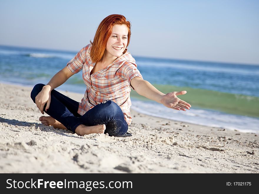 Happy Red-haired Girl At The Beach.