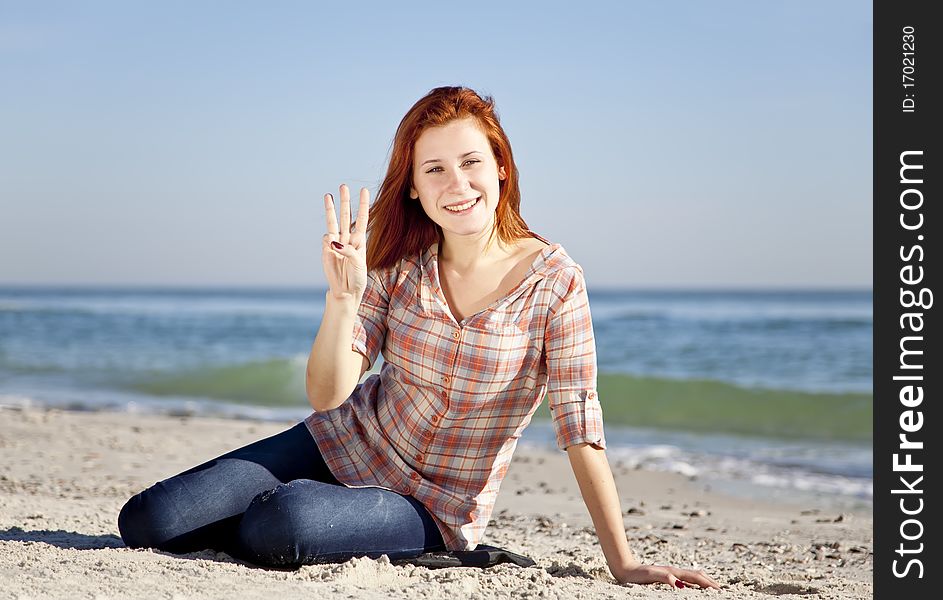 Happy Red-haired Girl At The Beach.