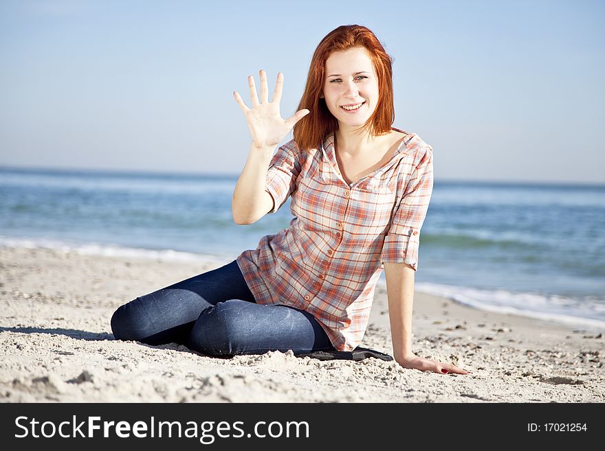 Happy Red-haired Girl At The Beach.