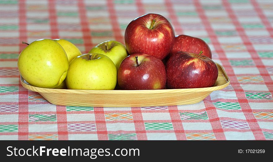 Apple of two kinds displayed on a cloth fabric. Apple of two kinds displayed on a cloth fabric