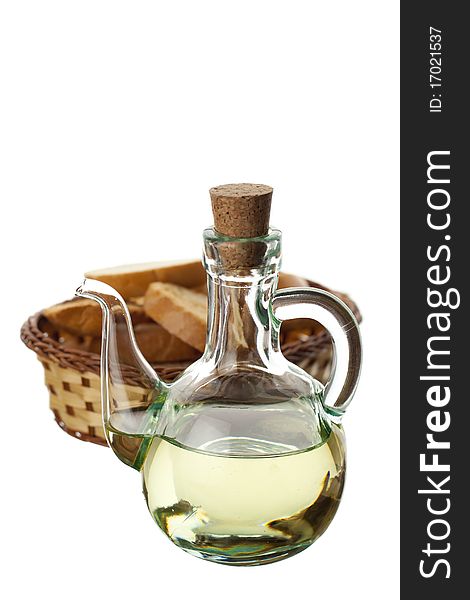 Olive oil in a transparent glass and bread isolated on white