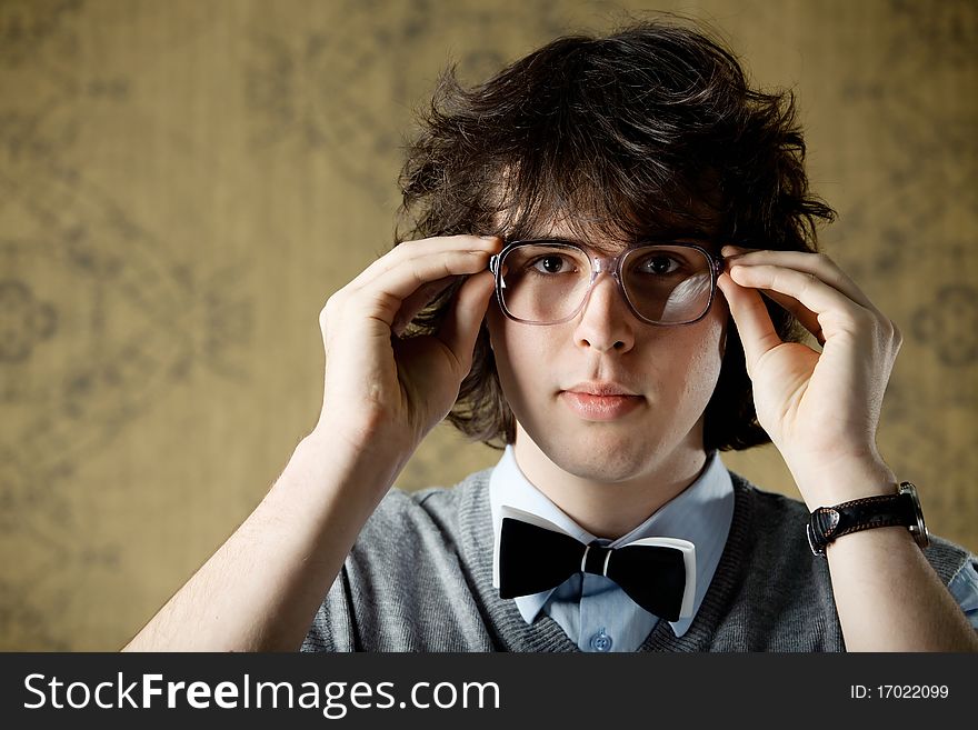 An image of a young man in big glasses. An image of a young man in big glasses