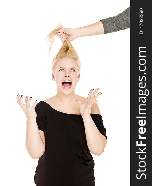 Blond woman in pain because someone pulling her hair. Blond woman in pain because someone pulling her hair