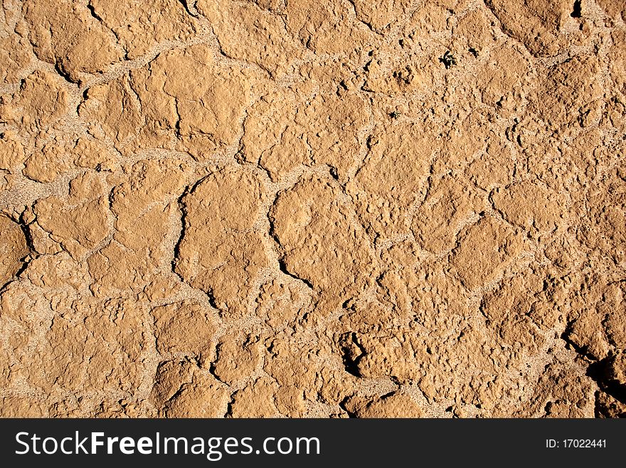 Closeup of the dried up surface of clay. Closeup of the dried up surface of clay