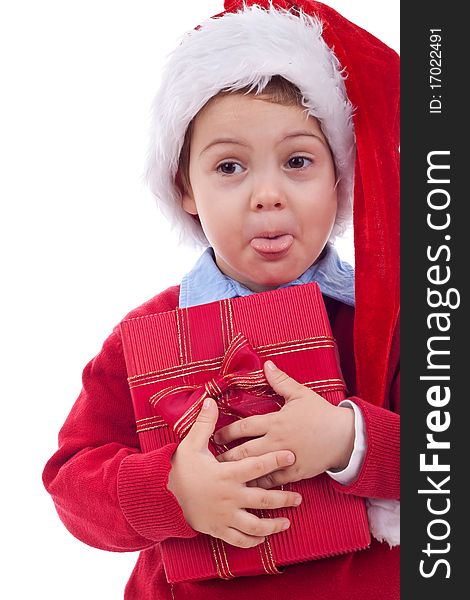 Little kid holding present and sticking out his tongue over white. Little kid holding present and sticking out his tongue over white