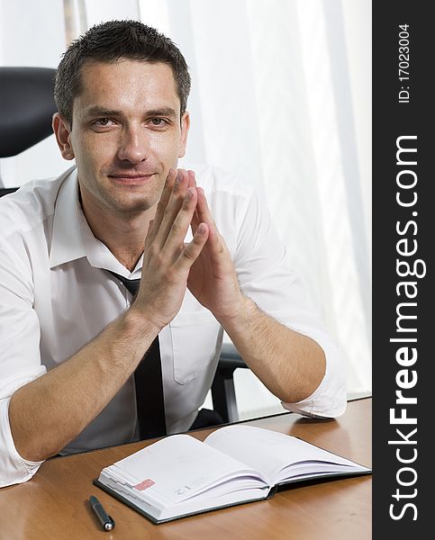 Office worker posing for camera indoor