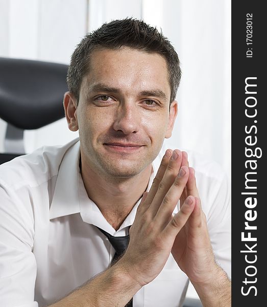 Office worker posing for camera indoor