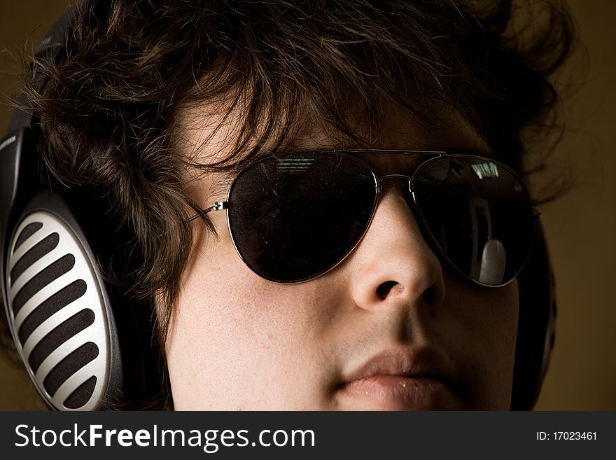 A portrait of a man listening to music in headphones. A portrait of a man listening to music in headphones