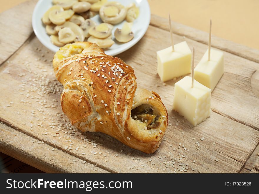 Fresh pastry filled with mushrooms served with cheese. Fresh pastry filled with mushrooms served with cheese