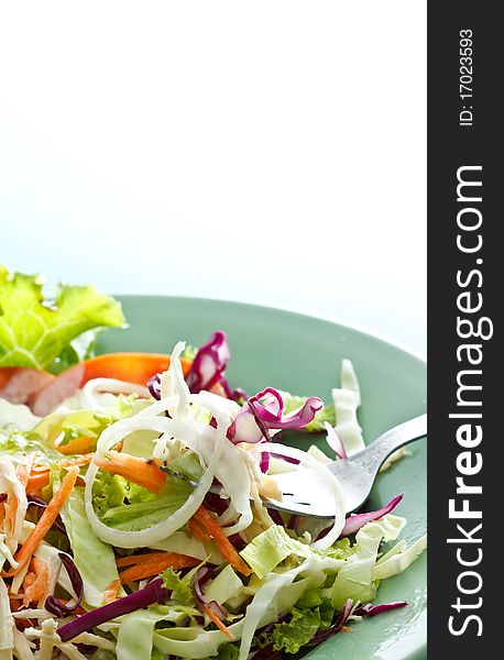 Fork and colorful mixed vegetable salad. Fork and colorful mixed vegetable salad
