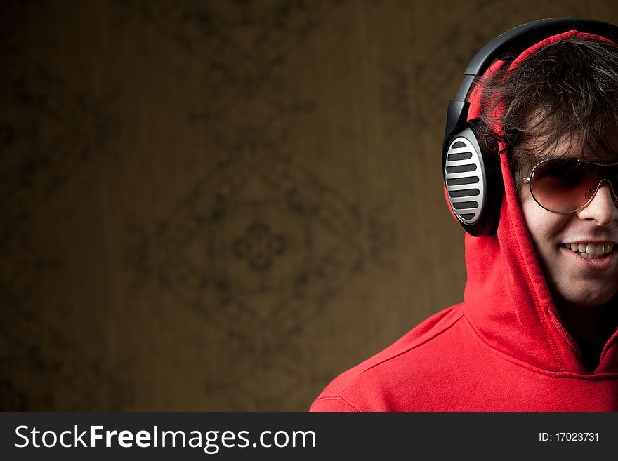 An image of a young boy listening to music in headphones