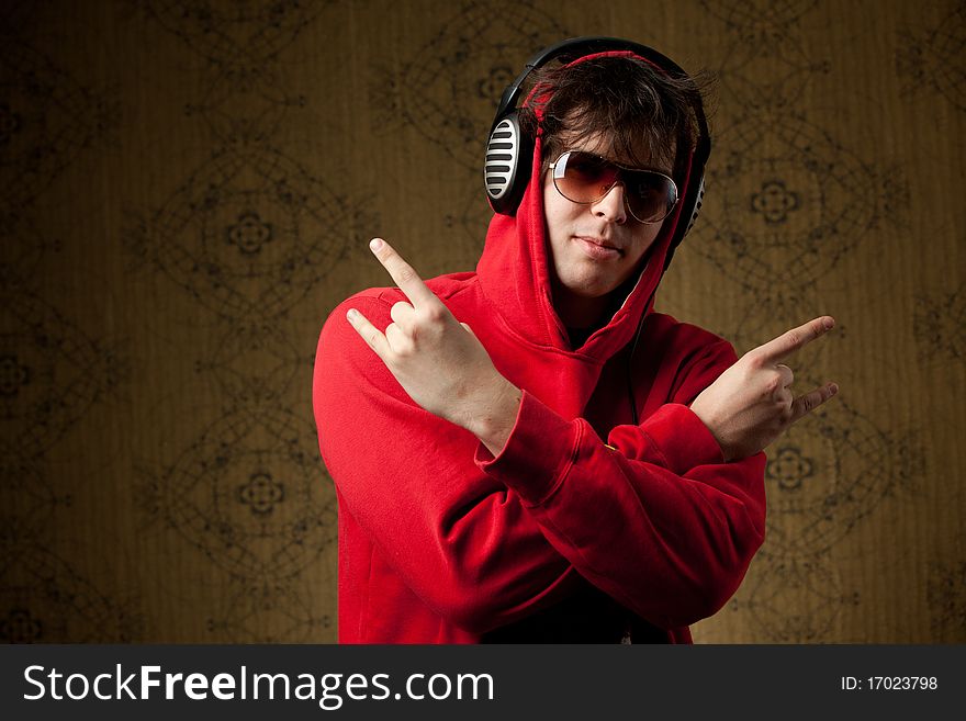 An image of a young boy listening to music in headphones