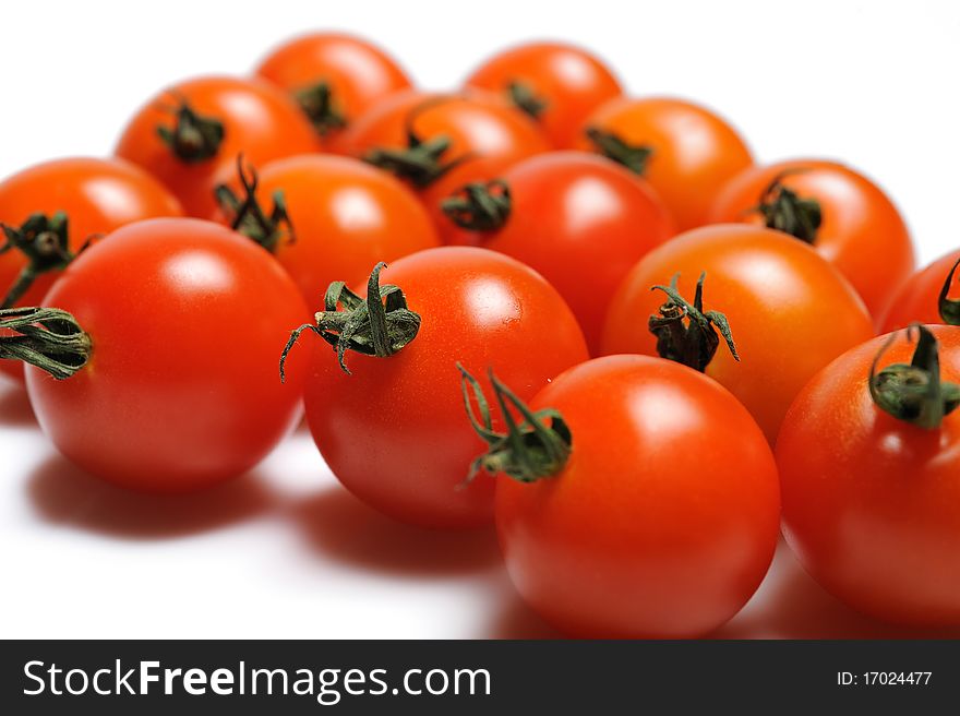 Many Beautiful red cherry tomato isolated on white background