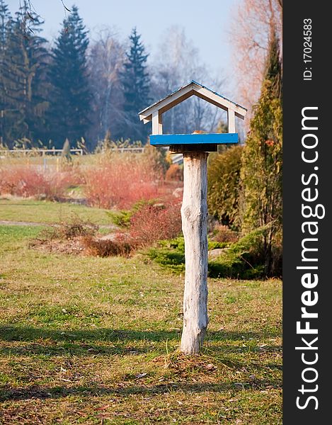 Bird feeders in a city park in autumn