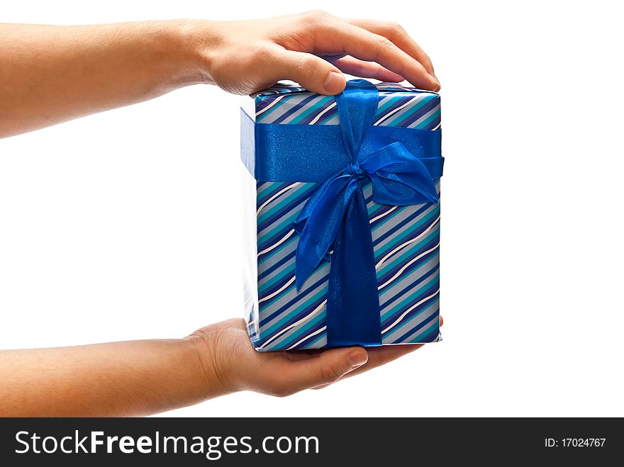 Blue gift box with bow in man's hands. Isolated on white. Blue gift box with bow in man's hands. Isolated on white
