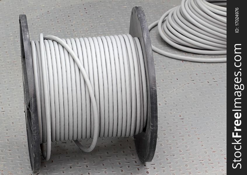 Thick electric cable on the plastic coil