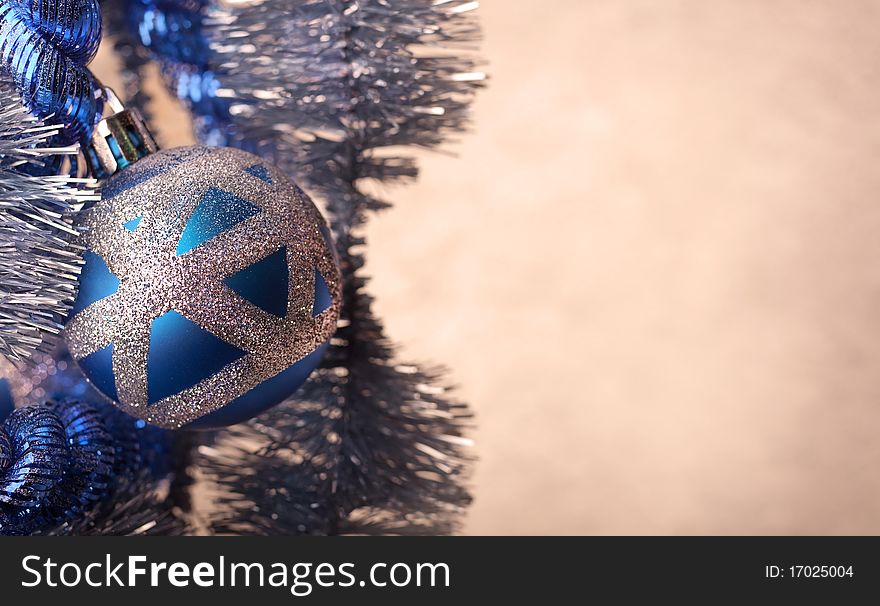 Blue Christmas ball with glitter, extreme close-up - copy space