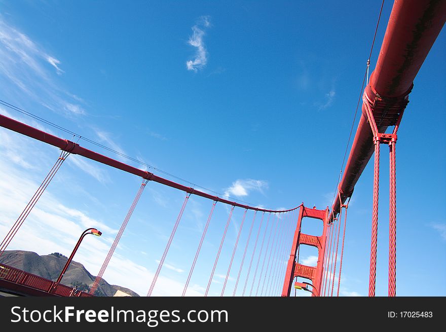 Fragment view on Golden Gate bridge in daylight, vertical. San-Francisco, California, USA. Fragment view on Golden Gate bridge in daylight, vertical. San-Francisco, California, USA